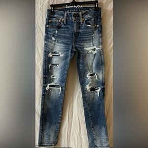 AE Airflex 360 patched jeans